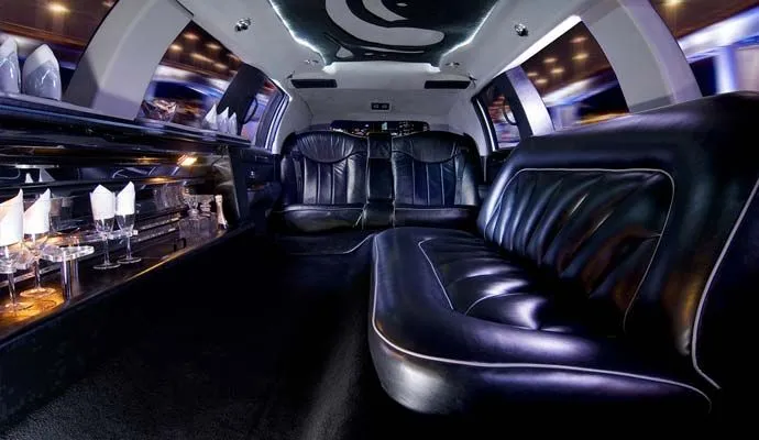 Limousine interior with leather seating and a built-in bar