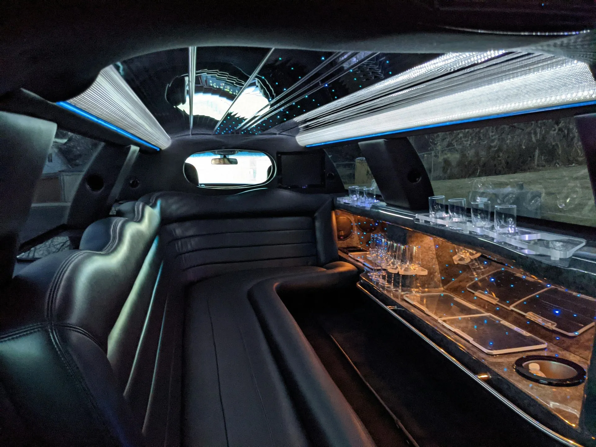 Modern limousine interior with leather seats and soft ambient lighting