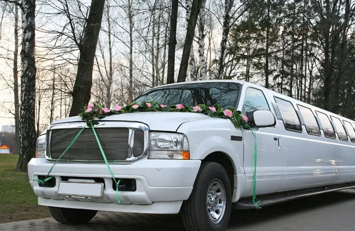 White stretch limousine decorated with flowers for a special celebration